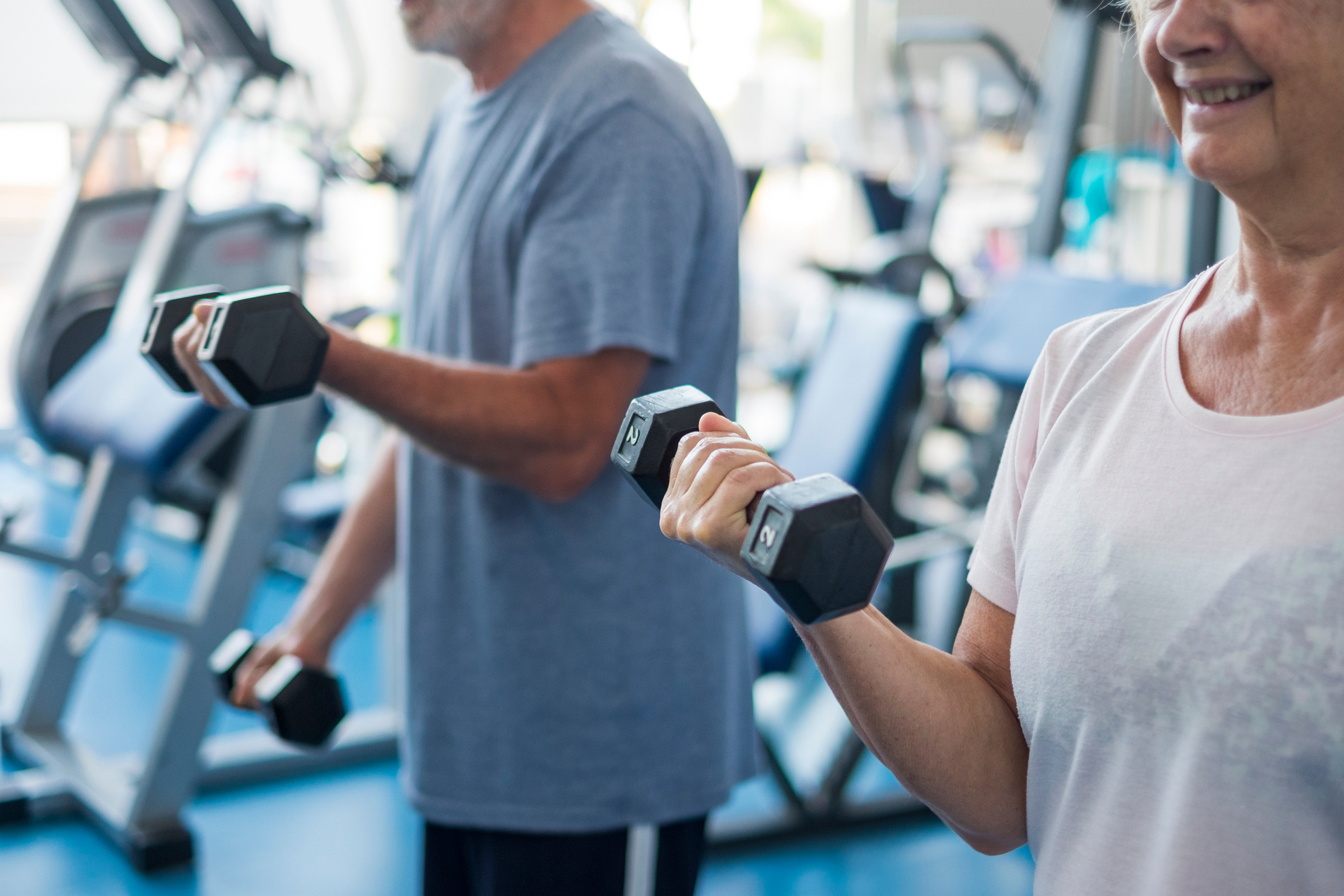 Couple of Two Seniors and Mature People at the Gym 